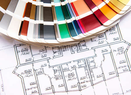 Architect workplace top view. Architectural project, blueprints, blueprint rolls on table. Construction background. Engineering tools. Copy spaceの写真素材
