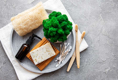 Zero waste natural cosmetics products on concrete background. Flat lay. 