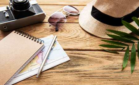 Summer holiday background, travel concept with camera on wooden table background. Flat layの写真素材