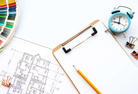 Architect workplace top view. Architectural project, blueprints, blueprint rolls on table....