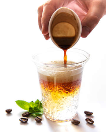 Coffee cocktail with  tonic on a white background