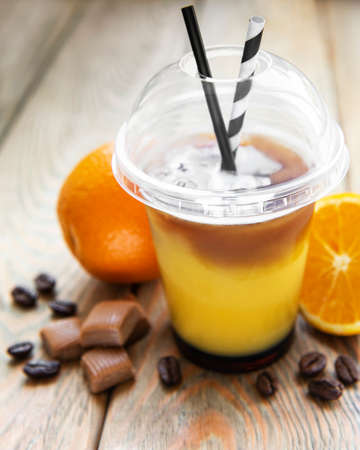 Orange and coffee cocktail on a old wooden backgroundの写真素材