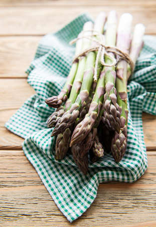 Asparagus on old wooden background. Food preparation. Healthy food.の写真素材
