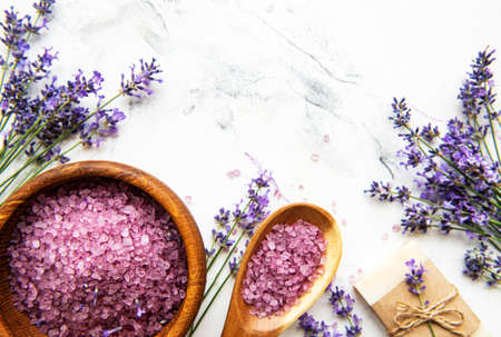 Natural herb cosmetic with lavender, flatlay on white marble background, top viewの写真素材