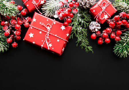 Christmas or New Year dark background with season decorations, space for a text, view from above