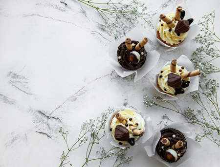 Chocolate cupcakes on white marble backgroundの写真素材