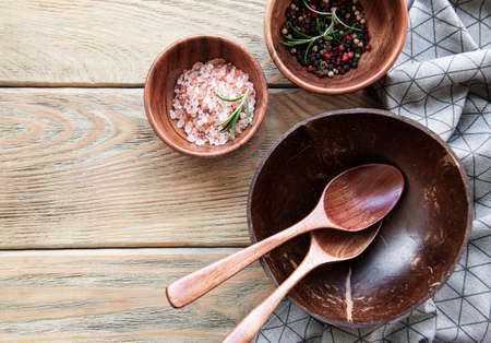 Top view on a wooden cutlery kitchen ware on a wooden background, flat layの写真素材