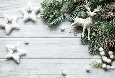 Christmas composition with deer, stars and fir branches. New Year background. Beautiful greeting card. Copy space. Top viewの写真素材