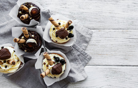 Chocolate cupcakes on white wooden backgroundの写真素材