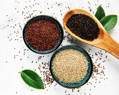 Red, black and white quinoa seeds on a concrete backgroundの写真素材