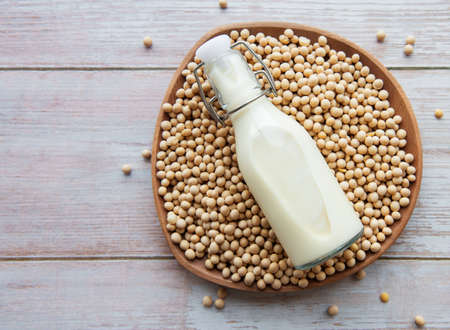 Soy milk and soy on the table - healthy plant productの写真素材