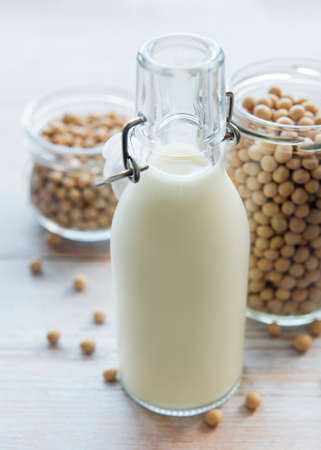 Soy milk and soy on the table - healthy plant productの写真素材