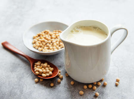 Soy milk and soy on the table - healthy plant productの写真素材