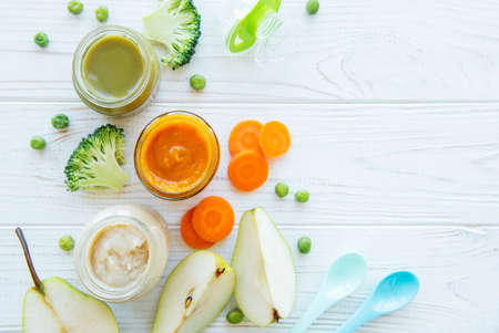 Baby food, assortment of fruit and vegetable puree, flat lay, top view, space for textの写真素材