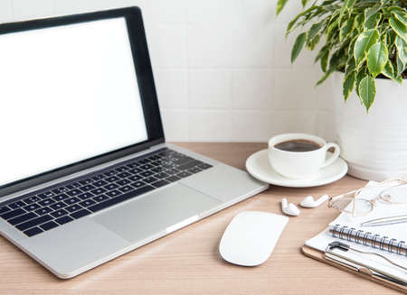 Office desktop. Laptop with office supplies on the table.