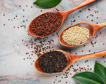 Red, black and white quinoa seeds on a concrete backgroundの写真素材