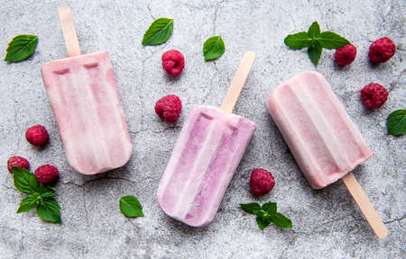 Homemade raspberry ice cream and fresh raspberries. Summer food.の写真素材