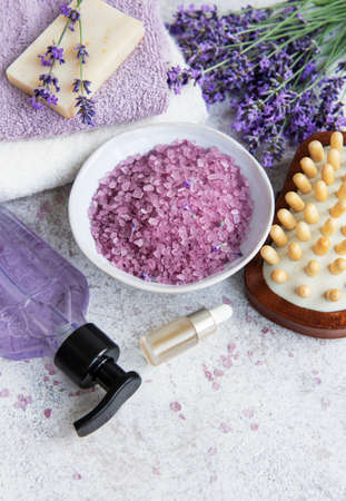 Lavender spa. Essential oils, sea salt, towels and handmade soap. Natural herb cosmetic with lavender flowersの写真素材