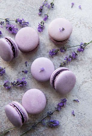 French macarons with lavender flavor and fresh lavender flowersの写真素材