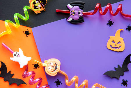 Modern background with bats, pumpkins, leaves, spiders on a violet background. Halloween with copy...