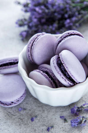 French macarons with lavender flavor and fresh lavender flowersの写真素材