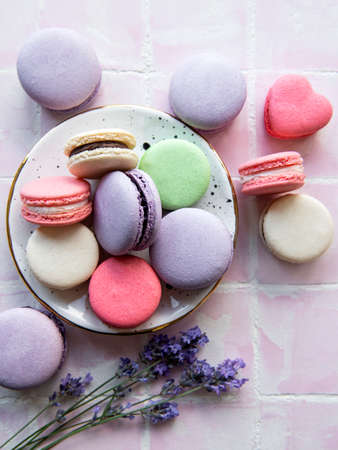 French macarons with different flavors and fresh lavender flowersの写真素材