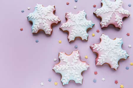 Christmas gingerbread cookies on a pink background. Homemade delicious Christmas gingerbreadの写真素材