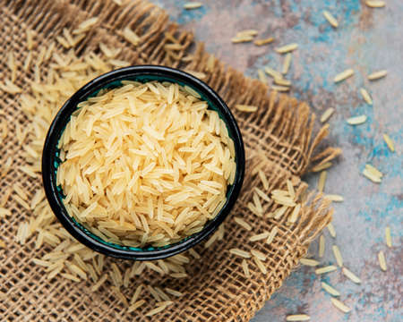 Uncooked basmati rice on a gray concrete backgroundの写真素材