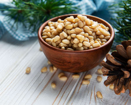 Pine nuts on a old wooden backgroundの写真素材
