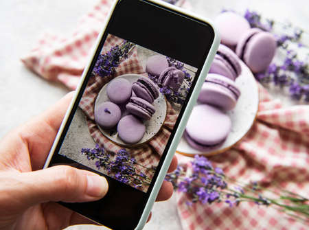 Food photography concept. Photo of French desserts macaroon with lavender taken on a smartphoneの写真素材