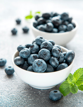 Freshly picked blueberries on a concrete background. Concept for healthy eatingの写真素材