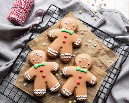 Christmas brown gingerbread man cookies on baking rack