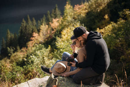 Man and woman travel together. Romantic traveler couple watching beautiful landscape, enjoying...
