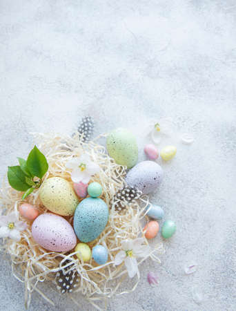 Top view of colorful easter eggs on concrete background