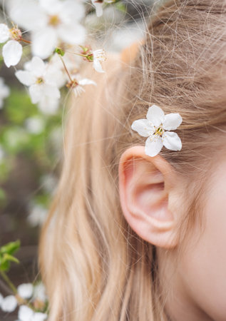 spring blossom. A girl with flowers in hair.の写真素材