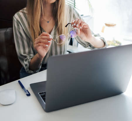 Young woman working on a computer in her officeの写真素材