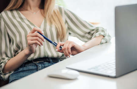 Young woman working on a computer in her office
