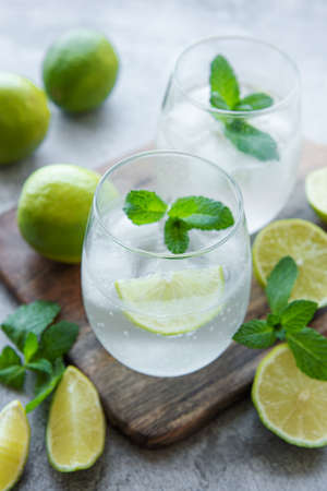 Iced cold lemonade with fresh lime and juice.  Summer drink in glass