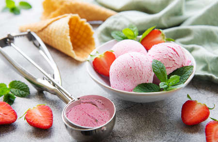 Homemade strawberry  ice cream with fresh strawberries. Sweet berry summer dessert. Concrete...