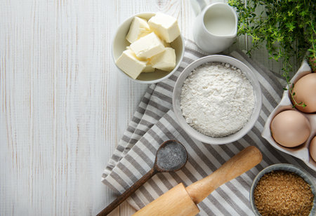Dough recipe ingredients on white rural wood kitchen tableの写真素材