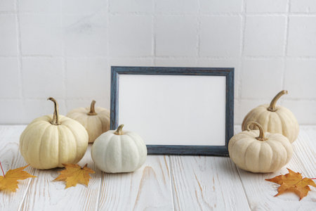 Interior design with autumn fall decor and picture frame mockup. Thanksgiving, Halloween holiday poster concept.の写真素材