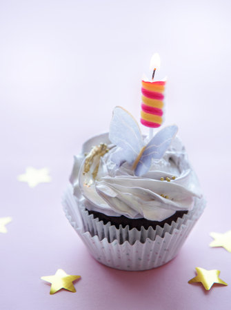Birthday holiday sweet cupcakes with butterfly decorationsの写真素材