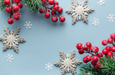 Christmas Background. Fir Tree Decorations  On  Light Vlue Background  With Copy Space. Christmas or New Year festive cardの写真素材