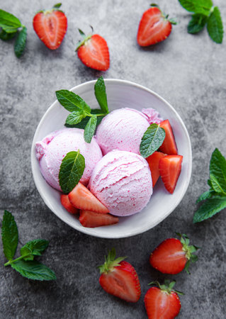 Homemade strawberry  ice cream with fresh strawberries. Sweet berry summer dessert.