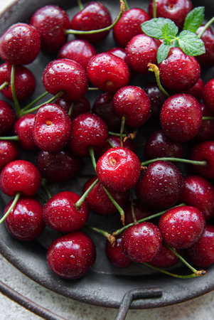 Fresh red cherries fruit  on a concrete background