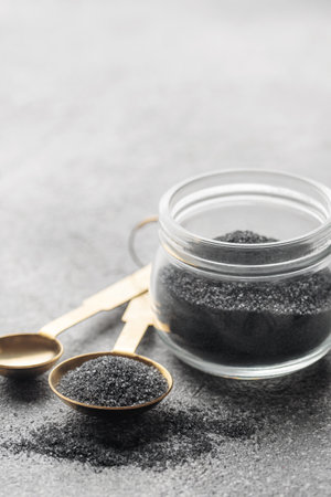 Jar of Hawaiian black  lava sea salt .  Healthy food concept. Speciality salt.の写真素材