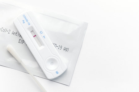 Home testing kit for coronavirus on a white background. Negative Covid-19 antigen test kit, one step...