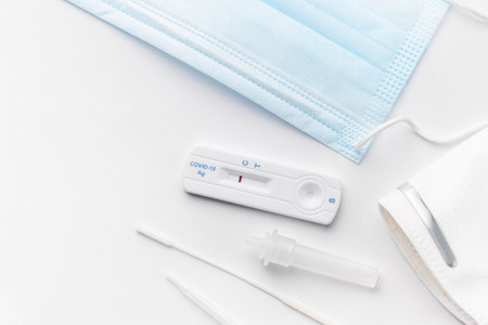 Home testing kit for coronavirus on a white background. Negative Covid-19 antigen test kit, one step coronavirus antigen rapid test.の写真素材