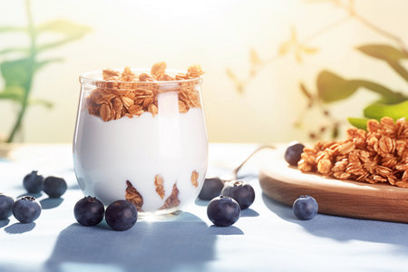Ai generative image. Jar of blueberry yogurt with granolaの素材
