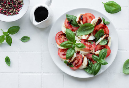 Caprese salad with tomatoes, mozzarella and basil. Healthy food.の写真素材